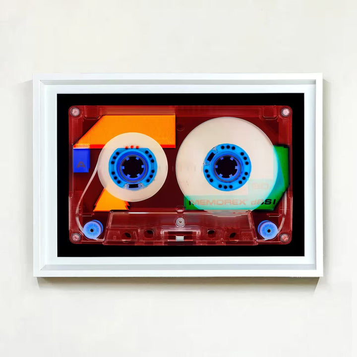 A white framed limited edition photograph by Richard Heeps using vibrant colours, the title is Tape Collection 90 Minutes A Side