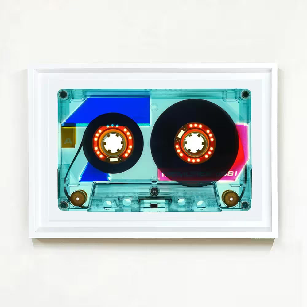 A white framed limited edition photograph by Richard Heeps using vibrant colours, the title is Tape Collection 90 Minutes Vintage Blue