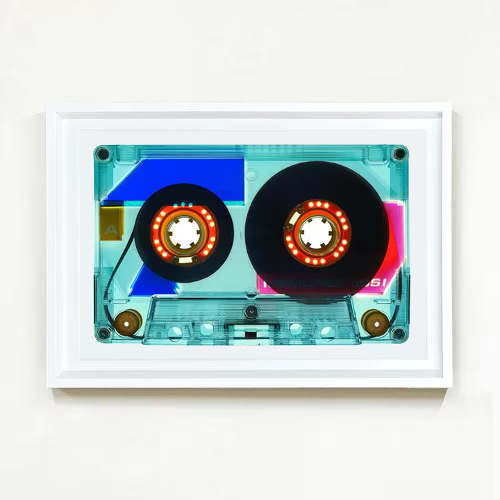 A white framed limited edition photograph by Richard Heeps using vibrant colours, the title is Tape Collection 90 Minutes Vintage Blue