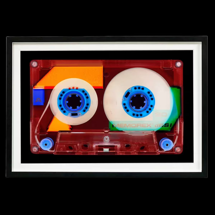 A framed limited edition photograph by Richard Heeps using vibrant colours, the title is Tape Collection 90 Minutes A Side