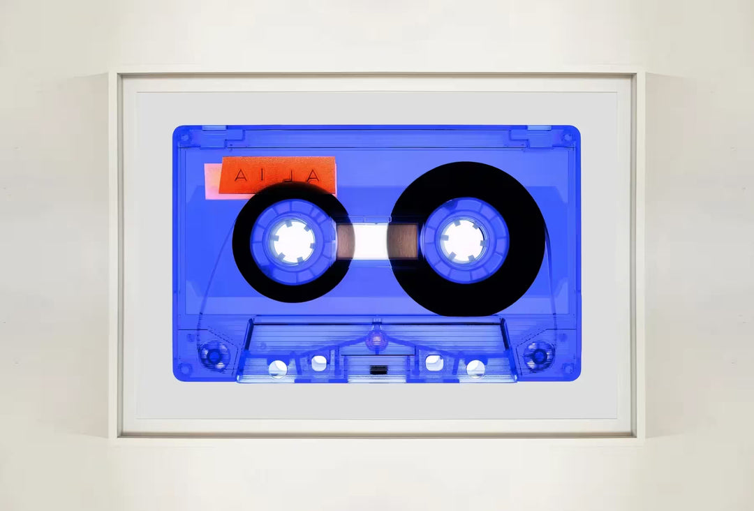 A white framed limited edition photograph by Richard Heeps using vibrant colours, the title is Tape Collection AILA Very Peri