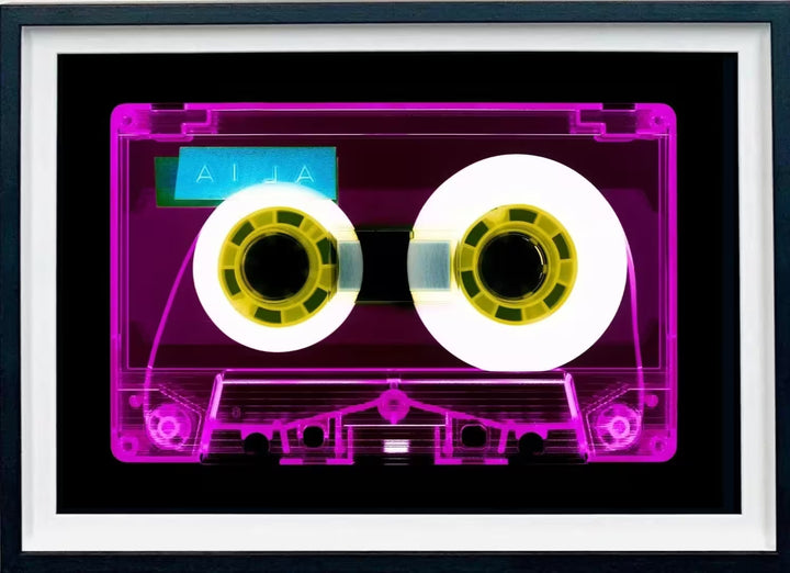 A framed limited edition photograph by Richard Heeps using vibrant colours, the title is Tape Collection AILA Pink