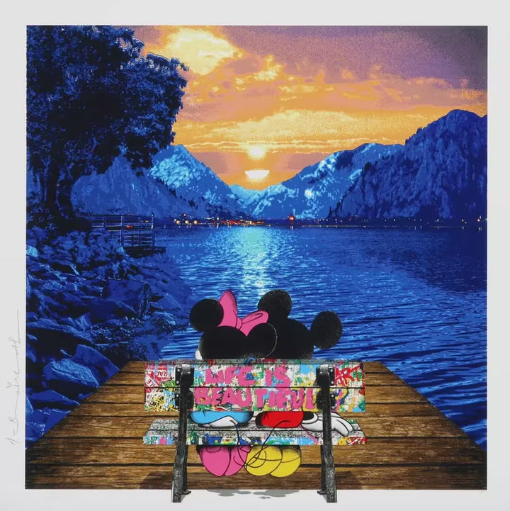 A Mr Brainwash limited edition of Mickey and Minnie Mouse sat on a bench overlooking a lake and mountains at sunset, the title is A World Full of Wonder