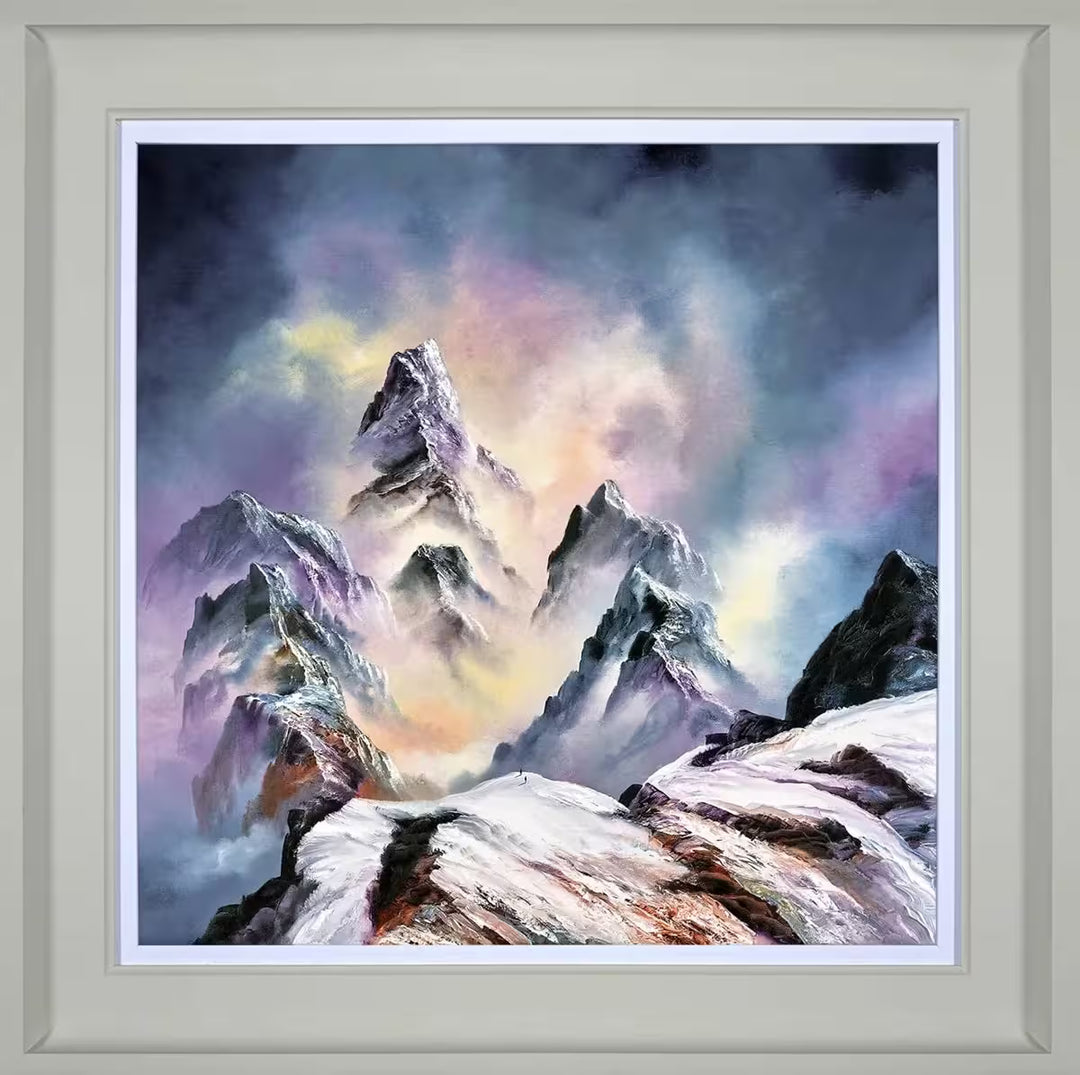 A Philip Gray framed limited edition print of a mountain range with the surrounding clouds glowing purple and orange, the title is A New World