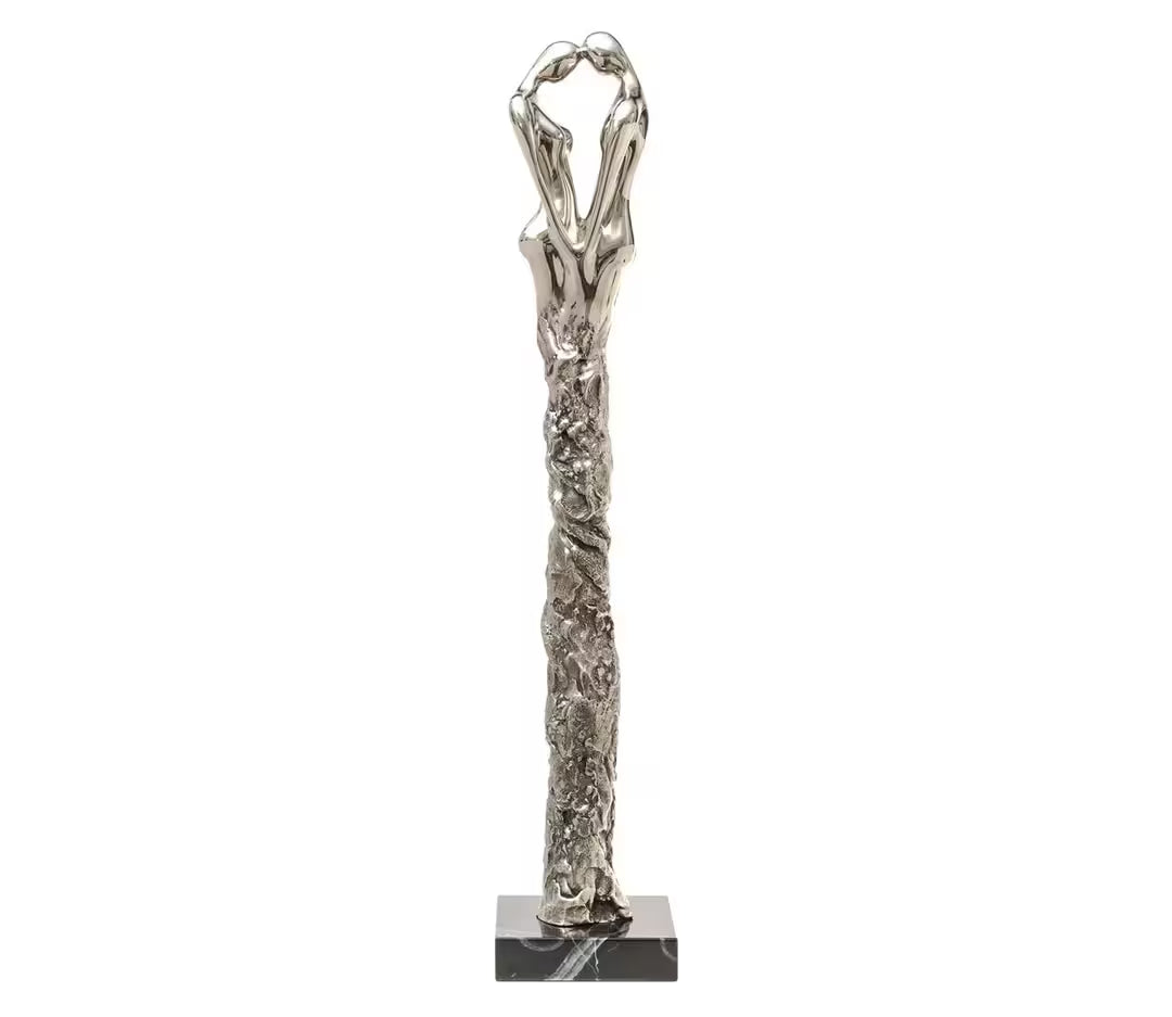 A Jennine Parker limited edition sculpture of two people with their heads together and their legs merging together, the title is Adoration II