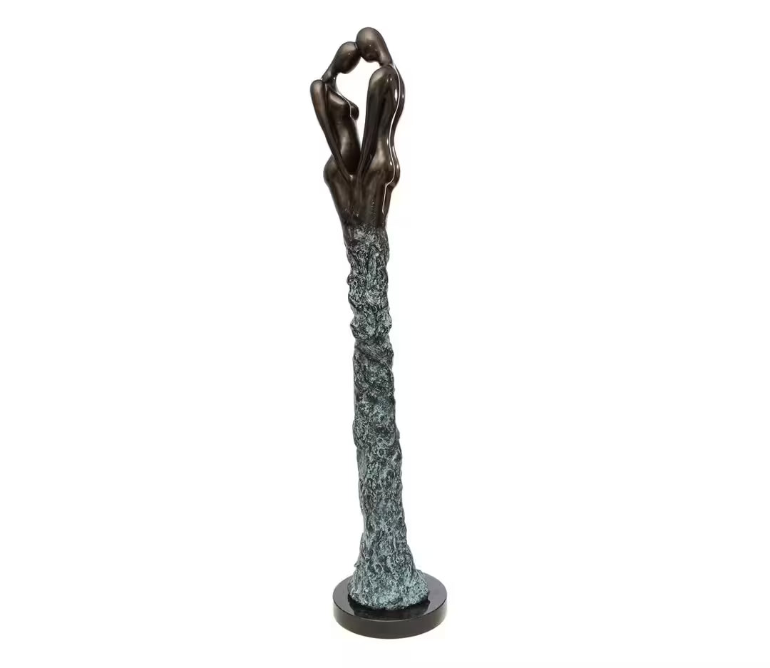 A Jennine Parker limited edition deluxe sculpture of two people with their heads to each other and their legs merged together, the title is Adoration I (Deluxe)