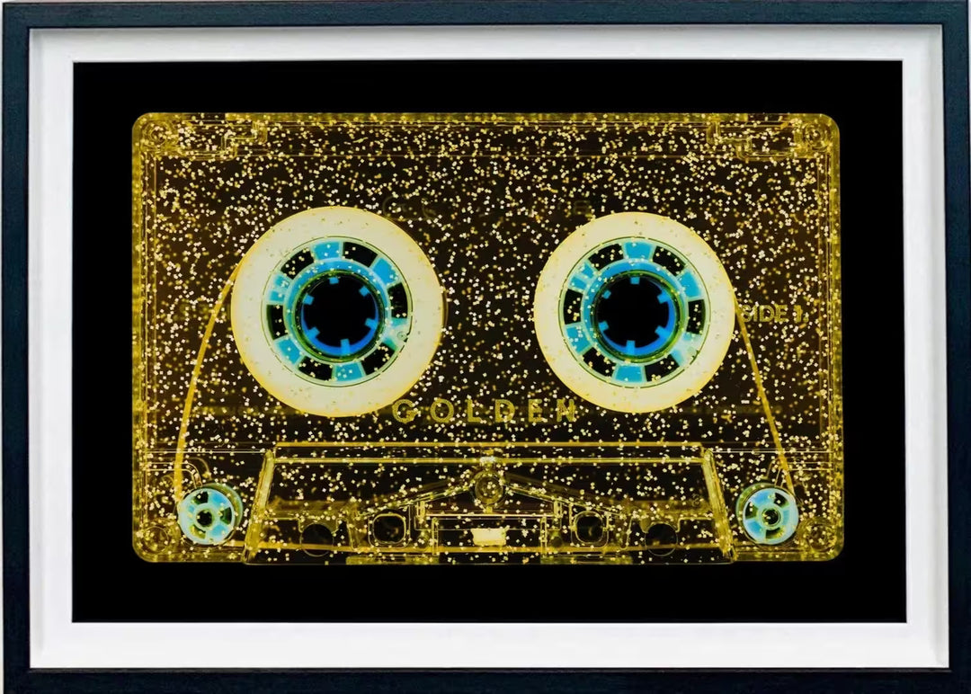 A framed limited edition photograph by Richard Heeps using vibrant colours, the title is Tape Collection All That Glitters is Golden
