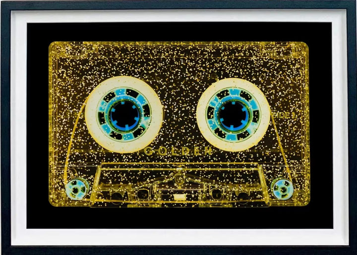 A framed limited edition photograph by Richard Heeps using vibrant colours, the title is Tape Collection All That Glitters is Golden