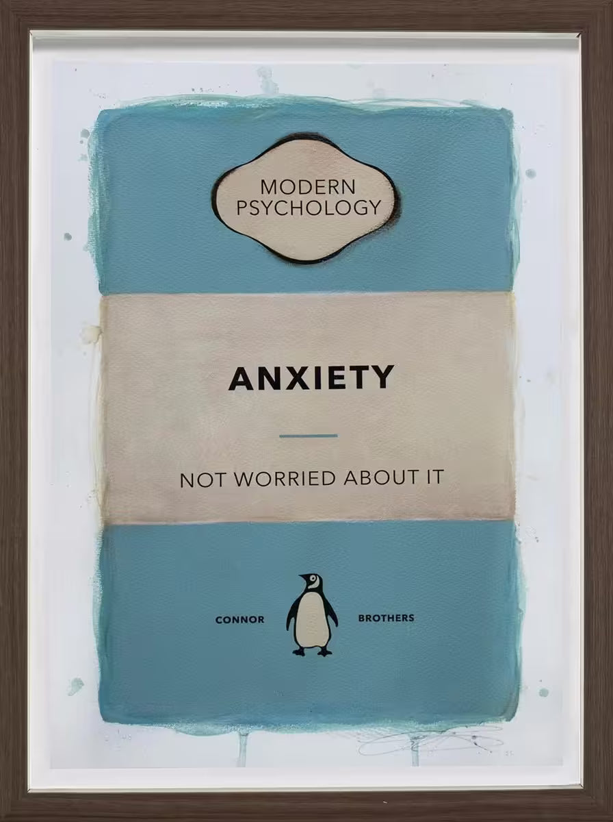 A limited edition framed print by The Connor Brothers of a penguin book cover with a witty line across the front, the title is Anxiety (Blue)