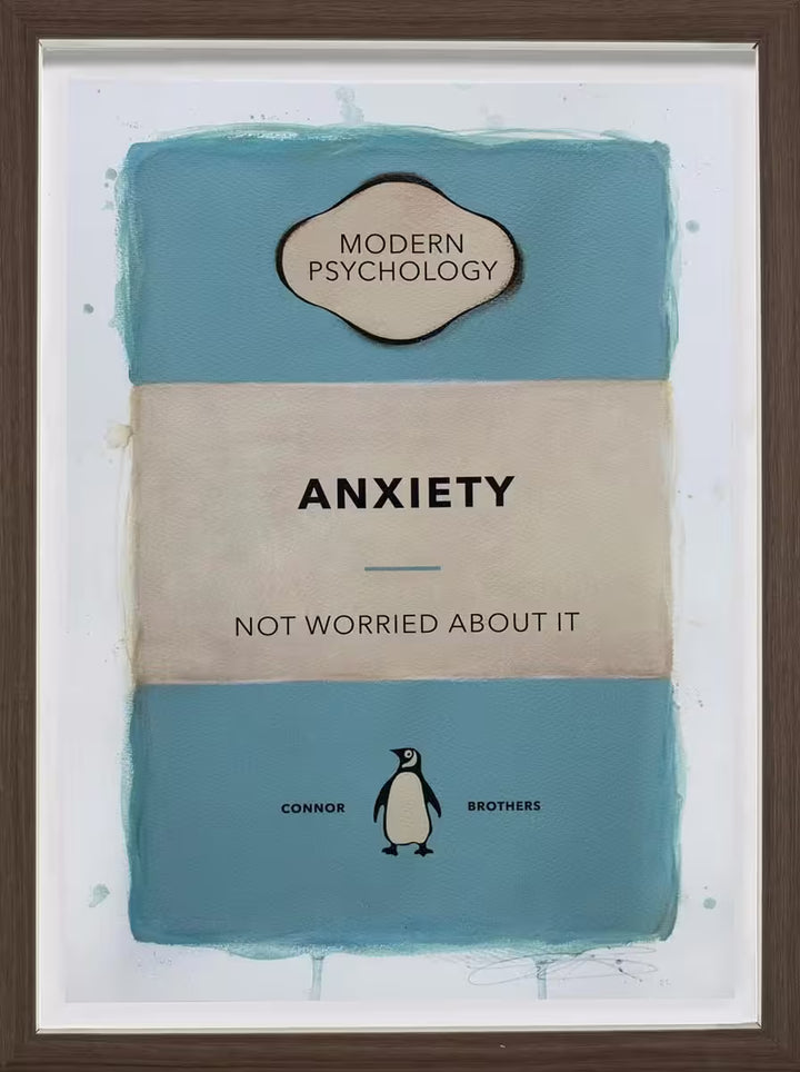 A limited edition framed print by The Connor Brothers of a penguin book cover with a witty line across the front, the title is Anxiety (Blue)