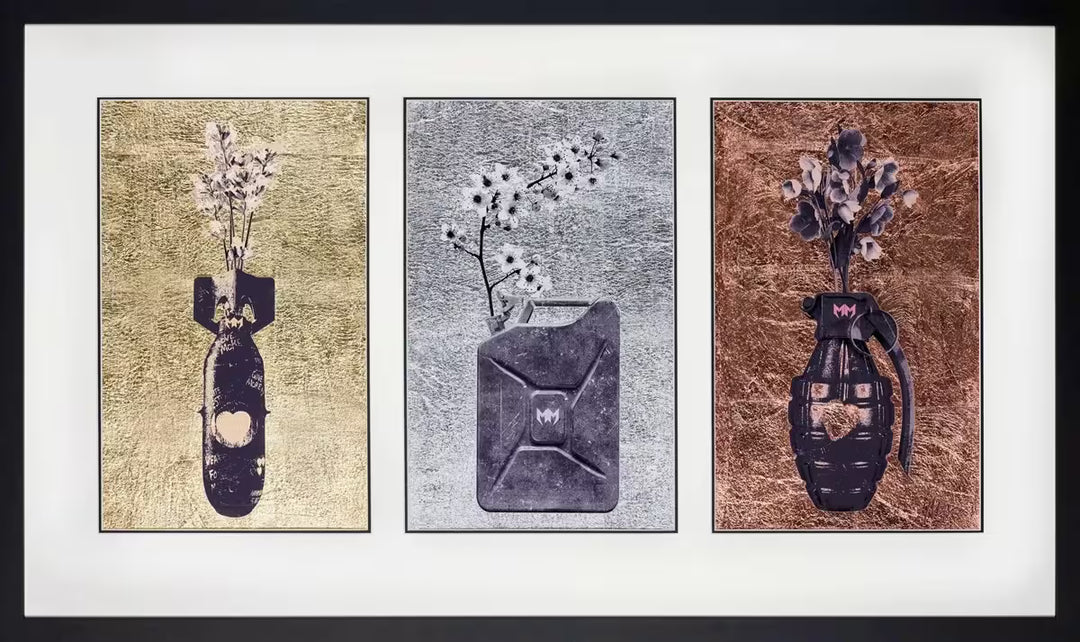 A Maxim limited edition of a bomb, carton, and grenade with flowers growing out of them, the title is Armed With Love