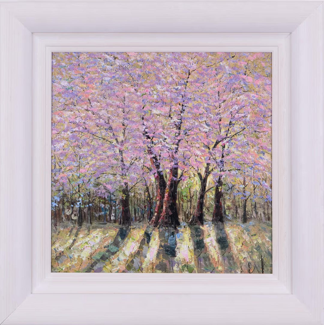 Framed painting of a forest scene with pink blossoms by Inam