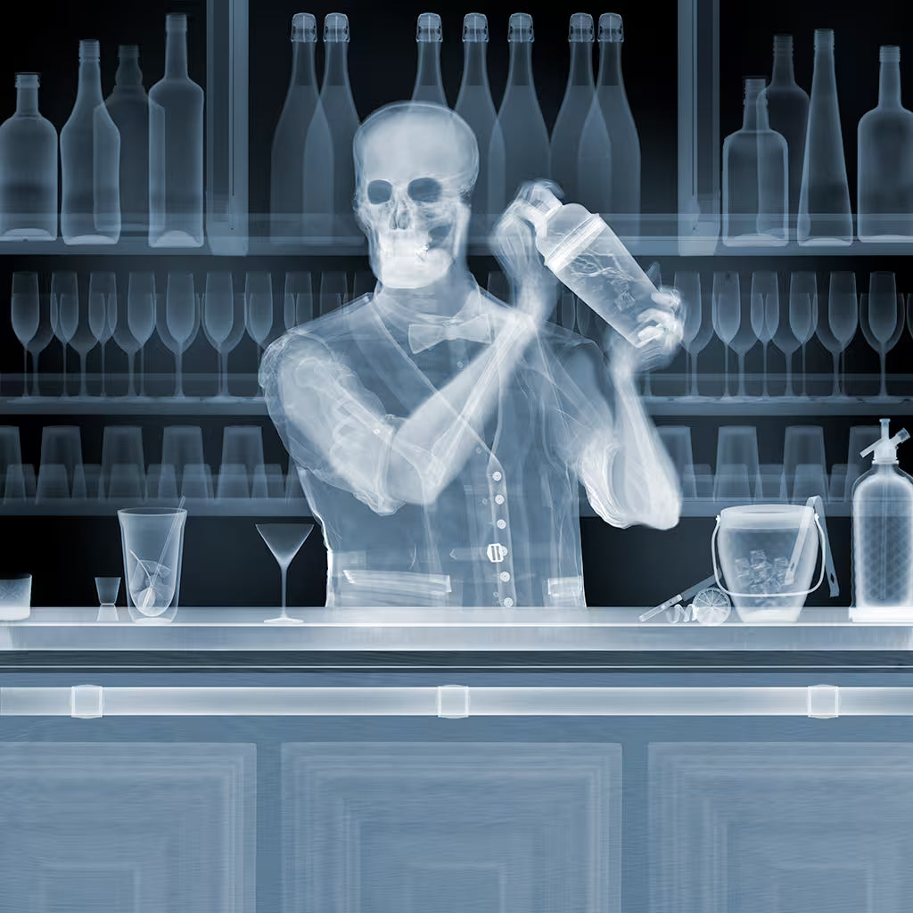 A Nick Veasey limited edition Chromaluxe of somebody behind a bar shaking a drink, the title is Bartender