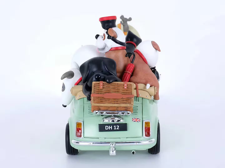 A Doug Hyde porcelain sculpture of a person in a green car with dogs and cats and beach items in the car, the title is Beach Buddies