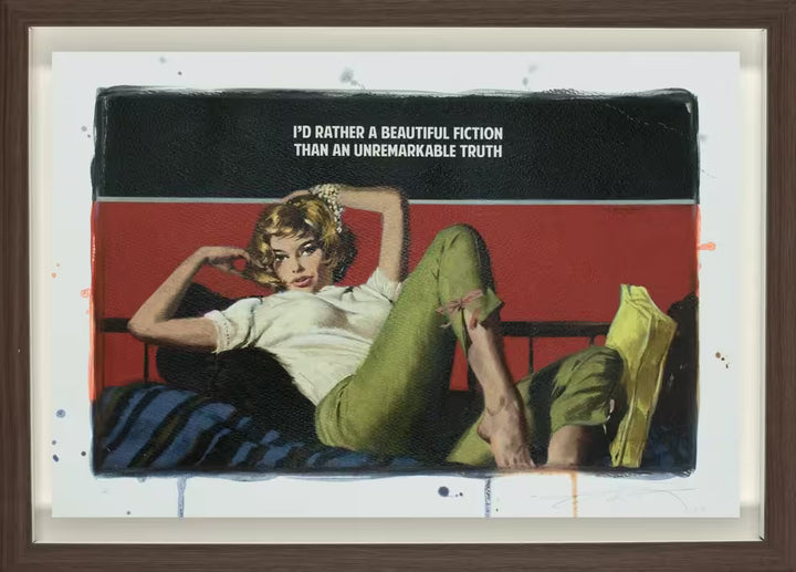 A limited edition framed piece by The Connor Brothers of a lady laying across a bed, the title is Beautiful Fiction 