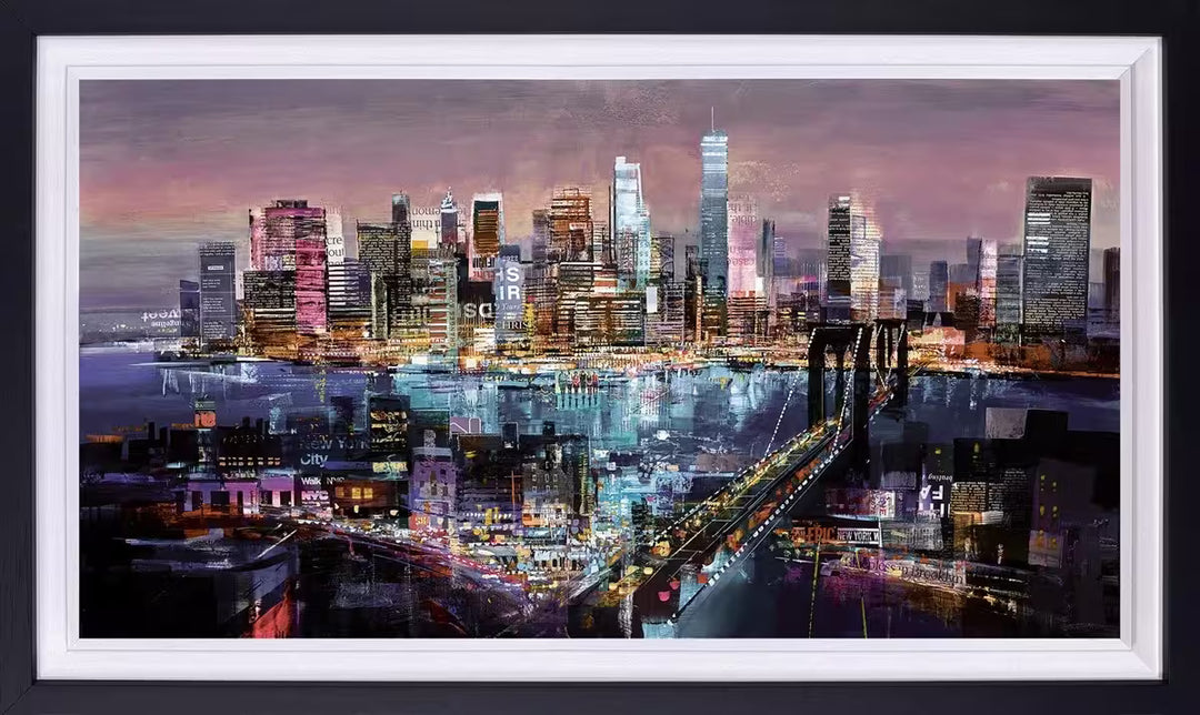  A Tom Butler framed limited edition collage of a city skyline in a dusky twilight sky with lights glowing from windows and cars, the title is Big City Lights