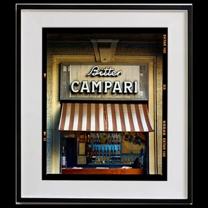 A framed limited edition photograph by Richard Heeps using vibrant colours, the title is Bitter Campari