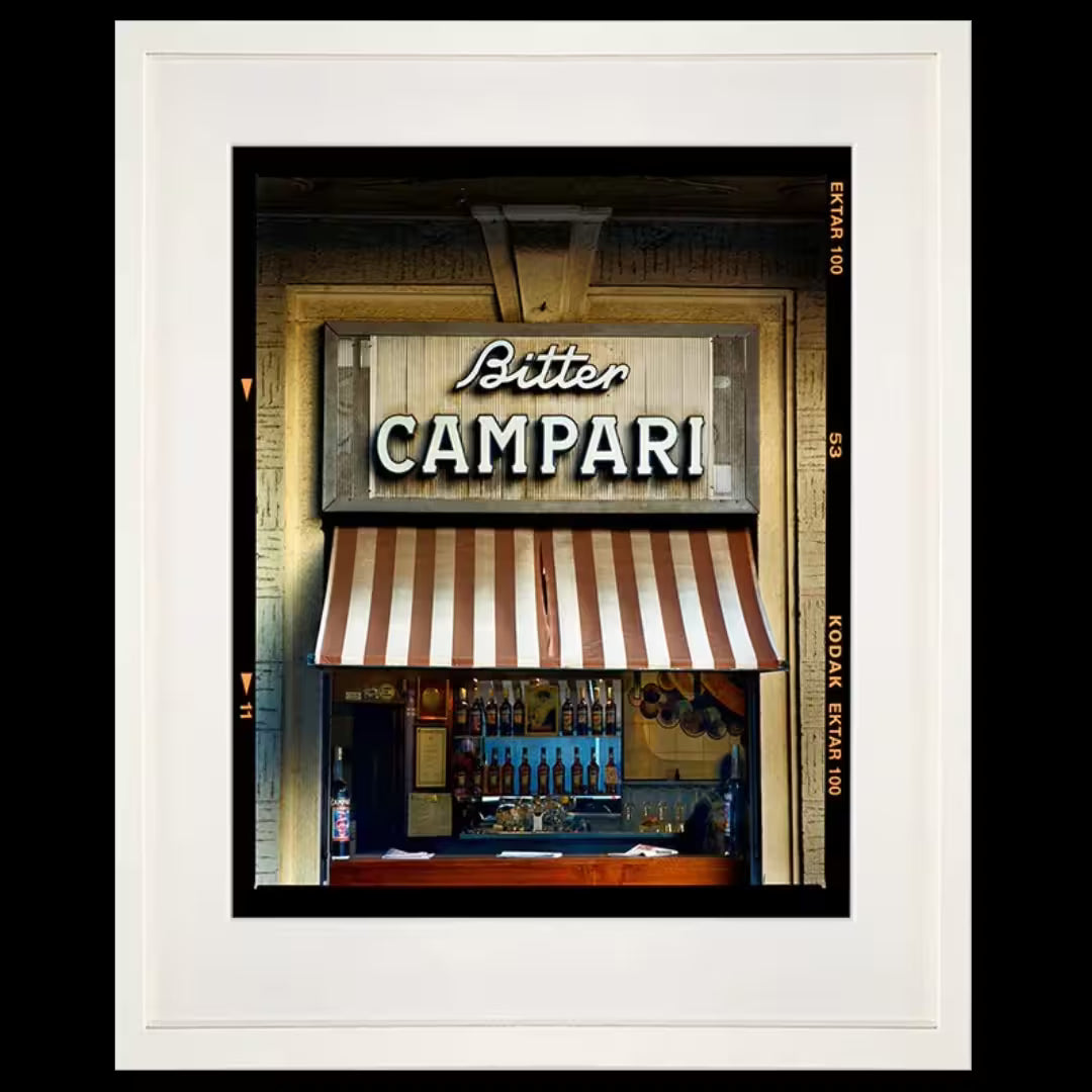 A framed limited edition photograph by Richard Heeps using vibrant colours, the title is Bitter Campari