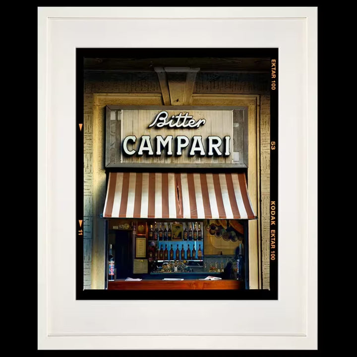 A framed limited edition photograph by Richard Heeps using vibrant colours, the title is Bitter Campari