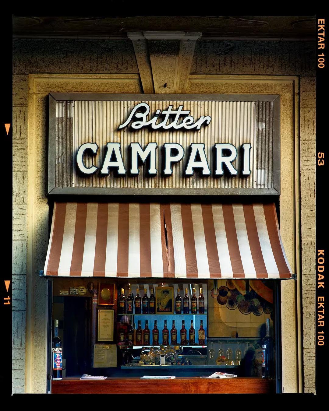 A limited edition photograph by Richard Heeps using vibrant colours, the title is Bitter Campari