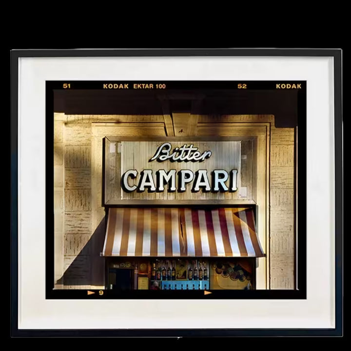A framed limited edition photograph by Richard Heeps using vibrant colours, the title is Bitter Campari Sign