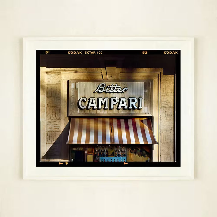 A framed limited edition photograph by Richard Heeps using vibrant colours, the title is Bitter Campari Sign