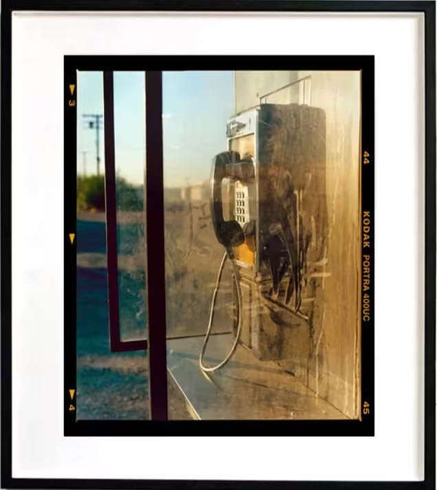 A framed limited edition photograph by Richard Heeps using vibrant colours, the title is Call Box, Salton Sea, California 2002