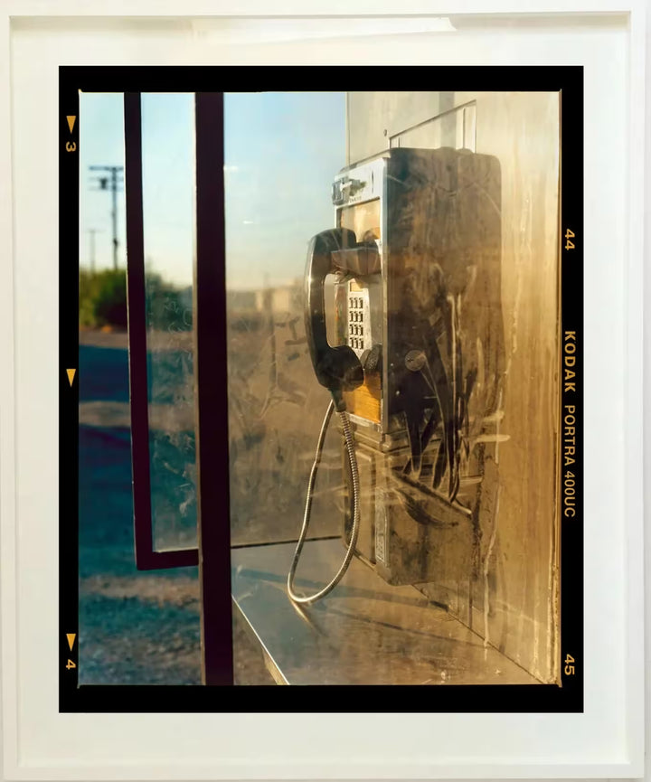A framed limited edition photograph by Richard Heeps using vibrant colours, the title is Call Box, Salton Sea, California 2002