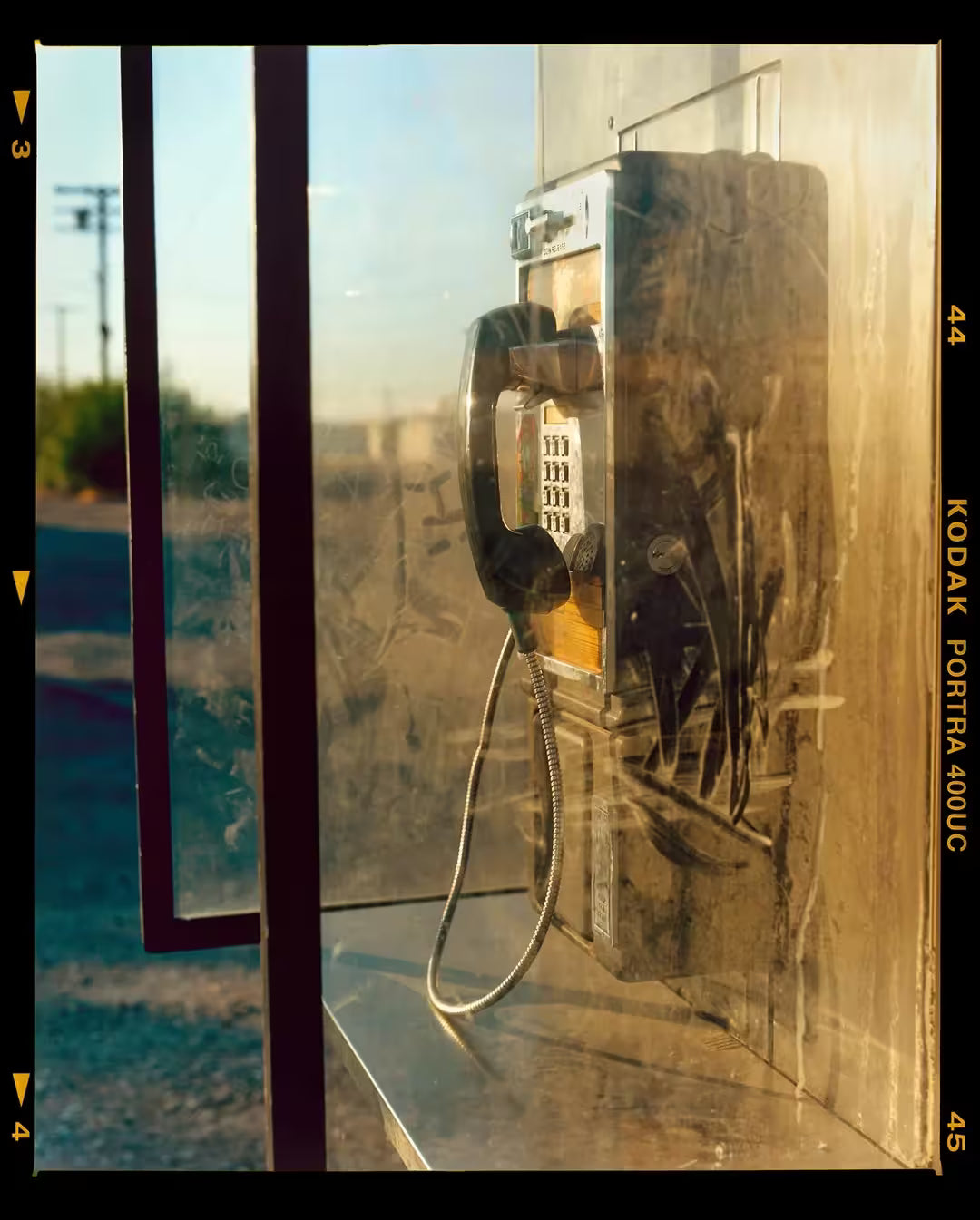 A limited edition photograph by Richard Heeps using vibrant colours, the title is Call Box, Salton Sea, California 2002
