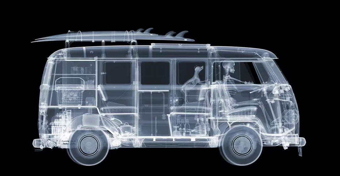 A limited edition Chromaluxe print by Nick Veasey of an X-Rayed vehicle with a skeleton driving it and a dog next to them, the title is VW Camper On The Road 