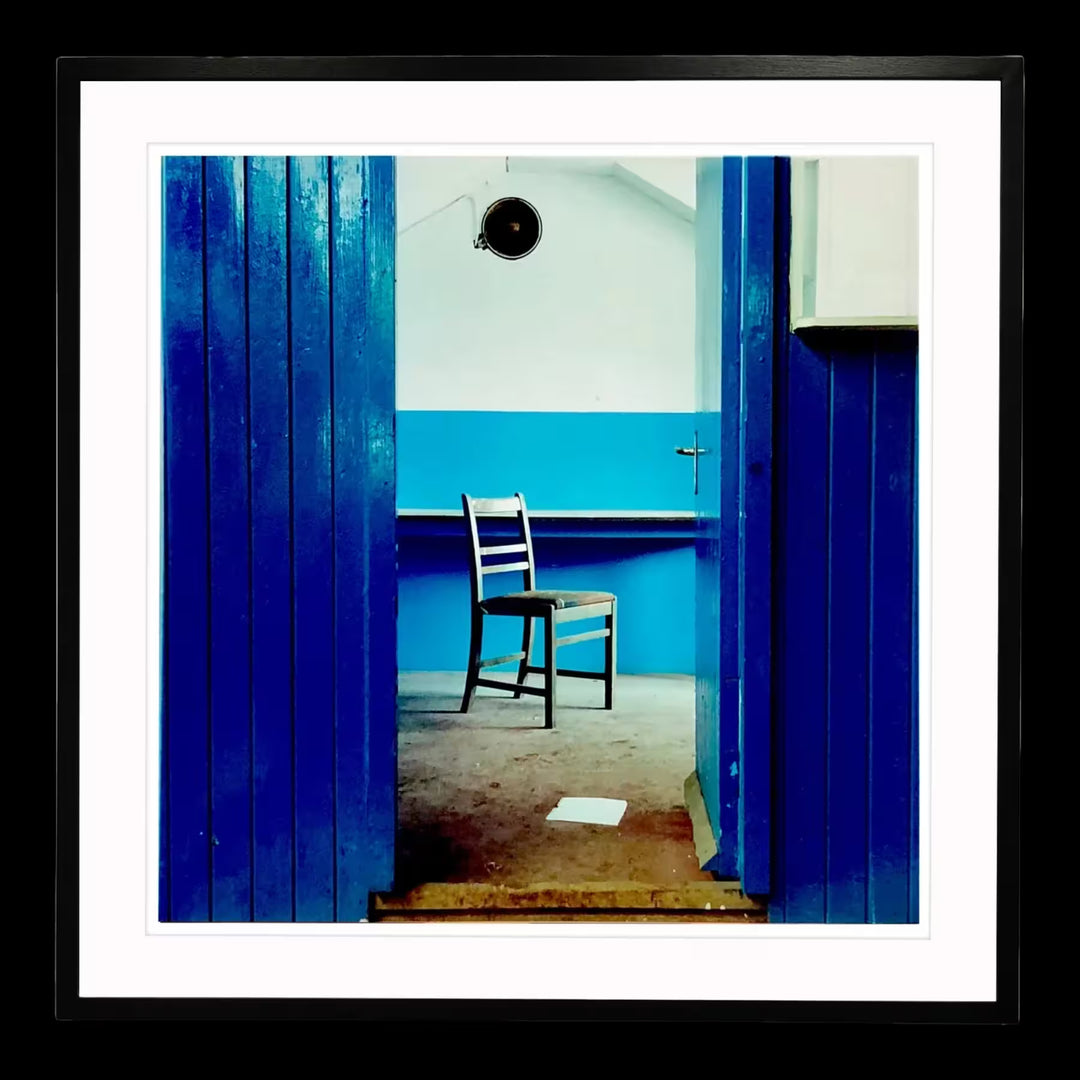 A framed limited edition photograph by Richard Heeps using vibrant colours, the title is Chair, Northwich, 1986