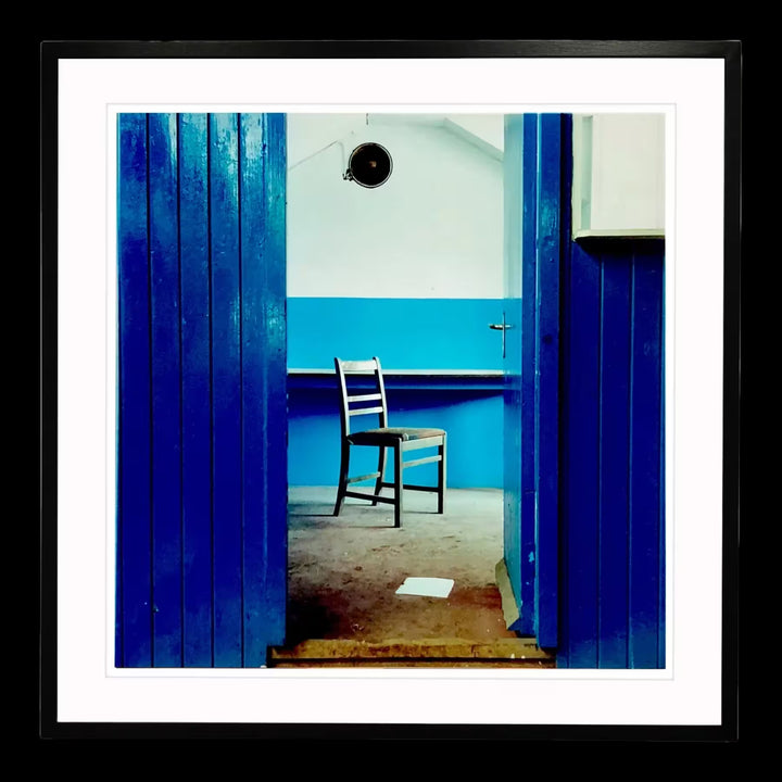 A framed limited edition photograph by Richard Heeps using vibrant colours, the title is Chair, Northwich, 1986