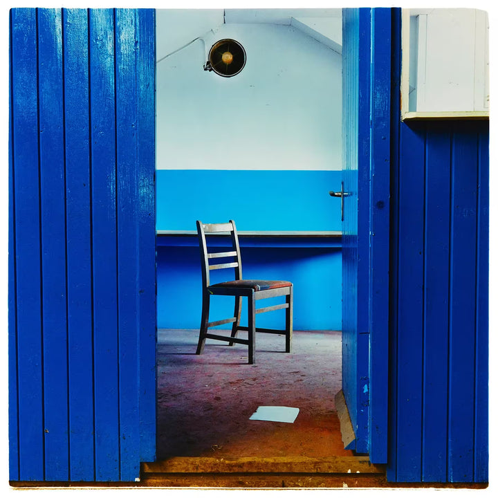 A limited edition photograph by Richard Heeps using vibrant colours, the title is Chair, Northwich, 1986