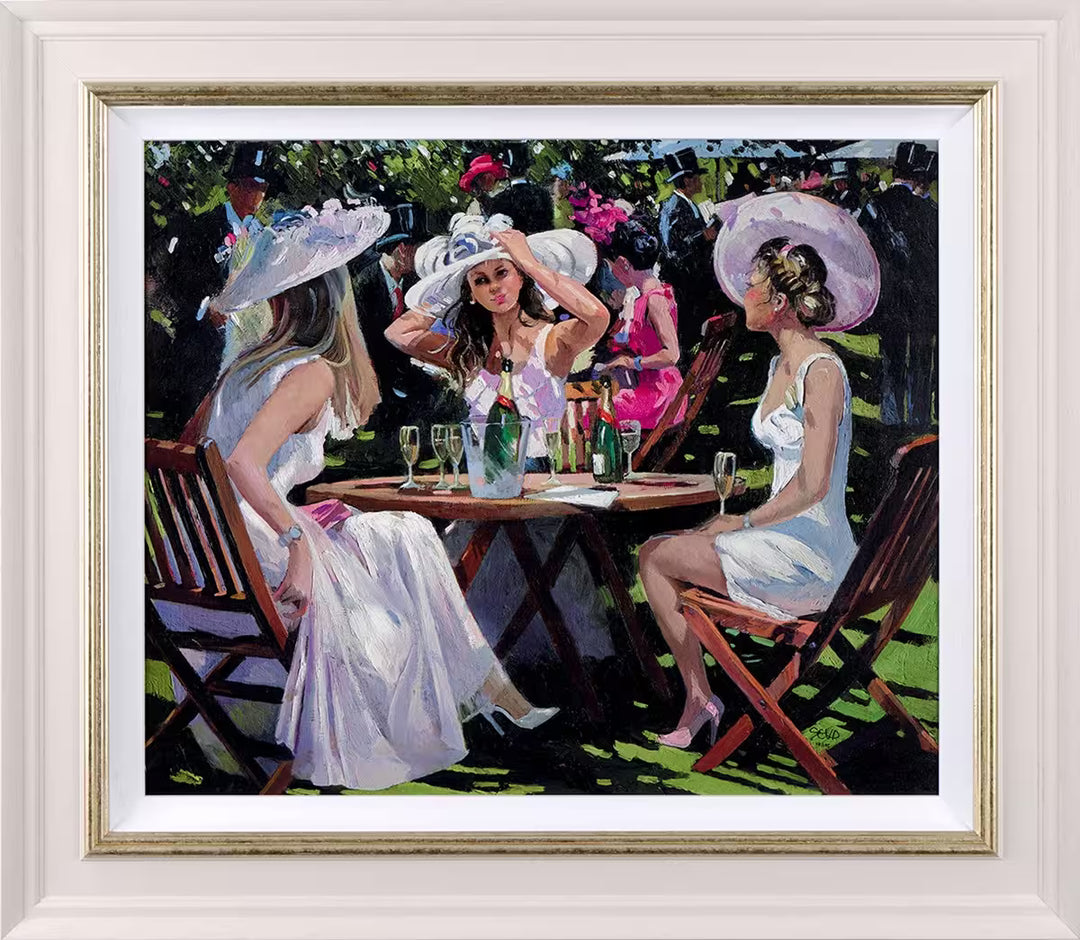 A Sherree Valentine Daines framed limited edition of three ladies sat drinking champagne, the title is Champagne At Ascot