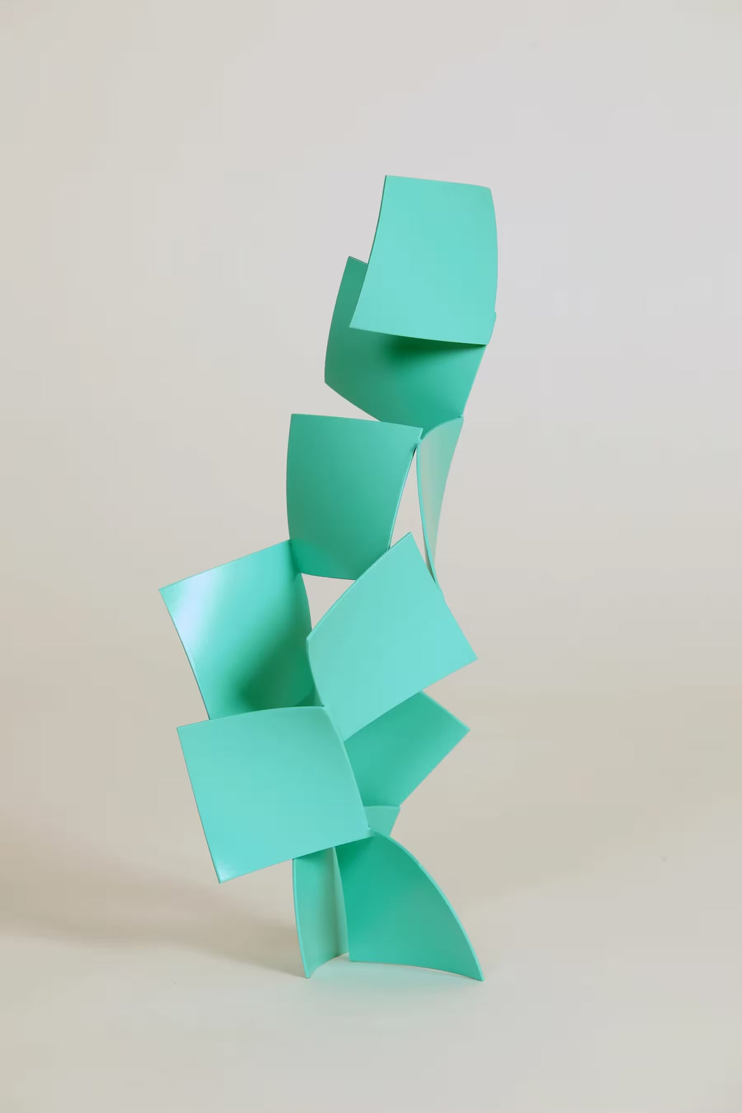 A Gareth Griffiths original geometric sculpture of thin squares arranged into a tower, the title is Chips