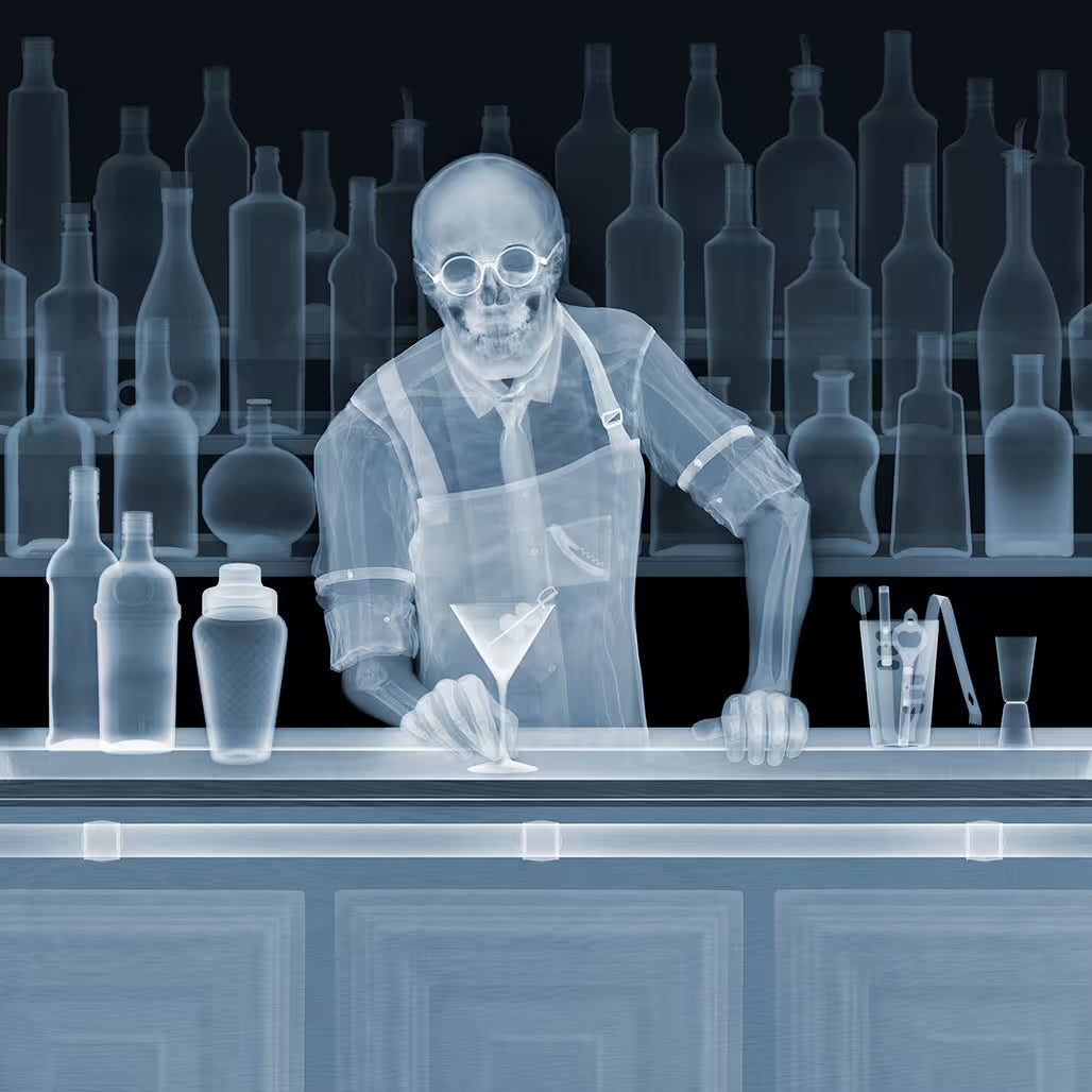 A Nick Veasey limited edition Chromaluxe Xray of a person handing over a drink over a bar, the title is Cocktail?