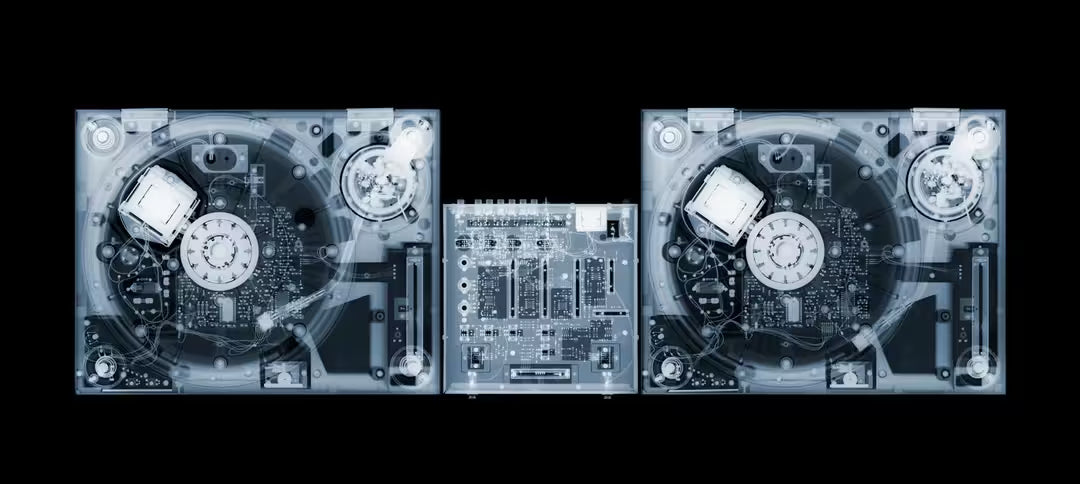 A limited edition Chromaluxe print by Nick Veasey of an X-Rayed DJ board stack, the title is Decks