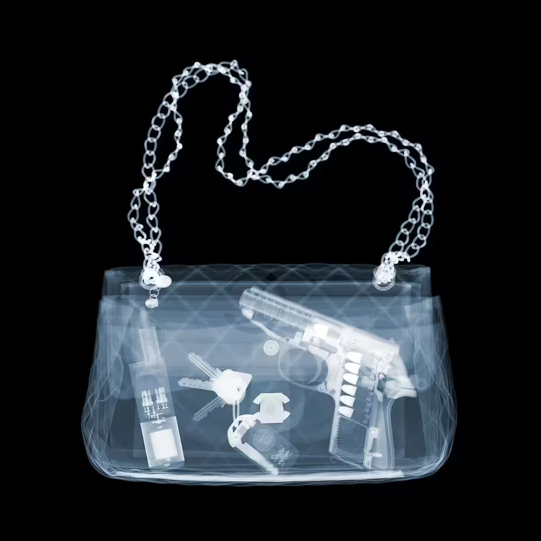 A limited edition Chromaluxe print by Nick Veasey of an X-Rayed handbag with a handgun and keys inside, the title is Don't Mess With The Ms