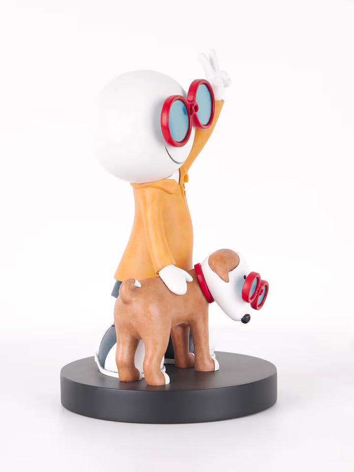 A Doug Hyde limited edition porcelain sculpture of a person making a peace sign with their dog in matching glasses, the title is Double Trouble