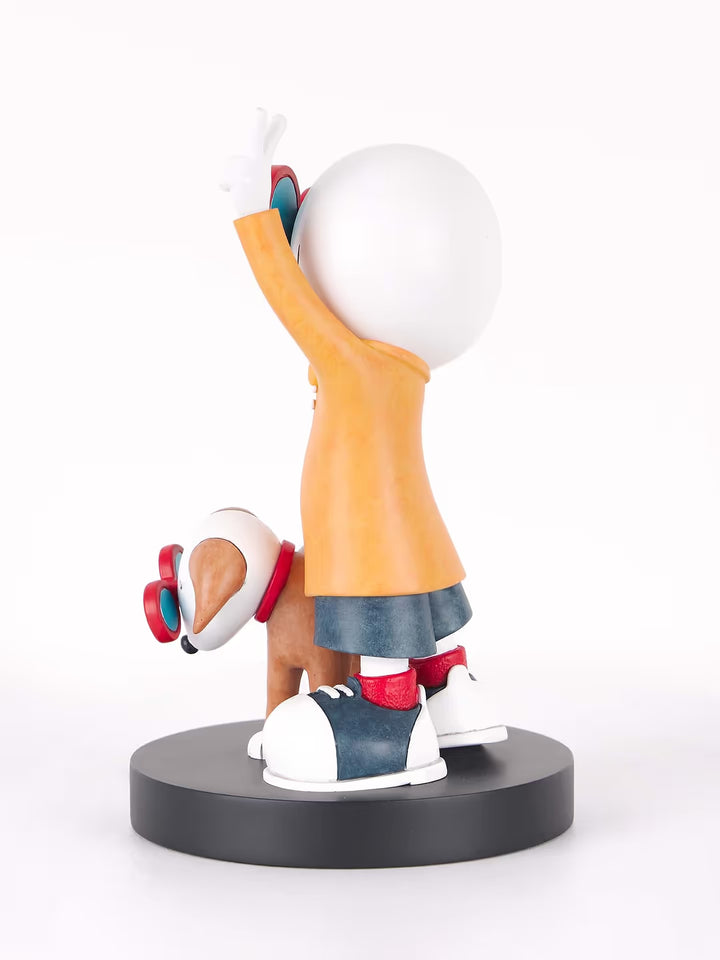 A Doug Hyde limited edition porcelain sculpture of a person making a peace sign with their dog in matching glasses, the title is Double Trouble