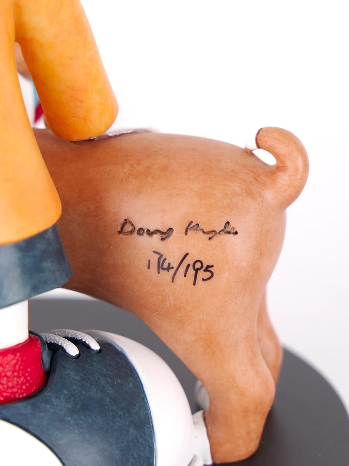 A Doug Hyde limited edition porcelain sculpture of a person making a peace sign with their dog in matching glasses, the title is Double Trouble