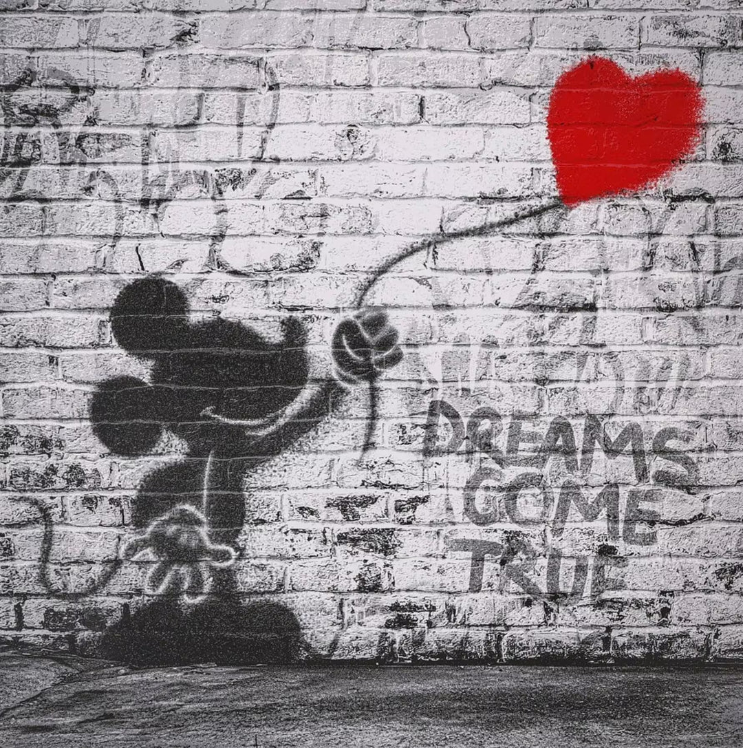 A Mr Brainwash limited edition of a grey wall with Mickey Mouse holding onto a red heart balloon spray painted onto it, the title is Dreams Come True