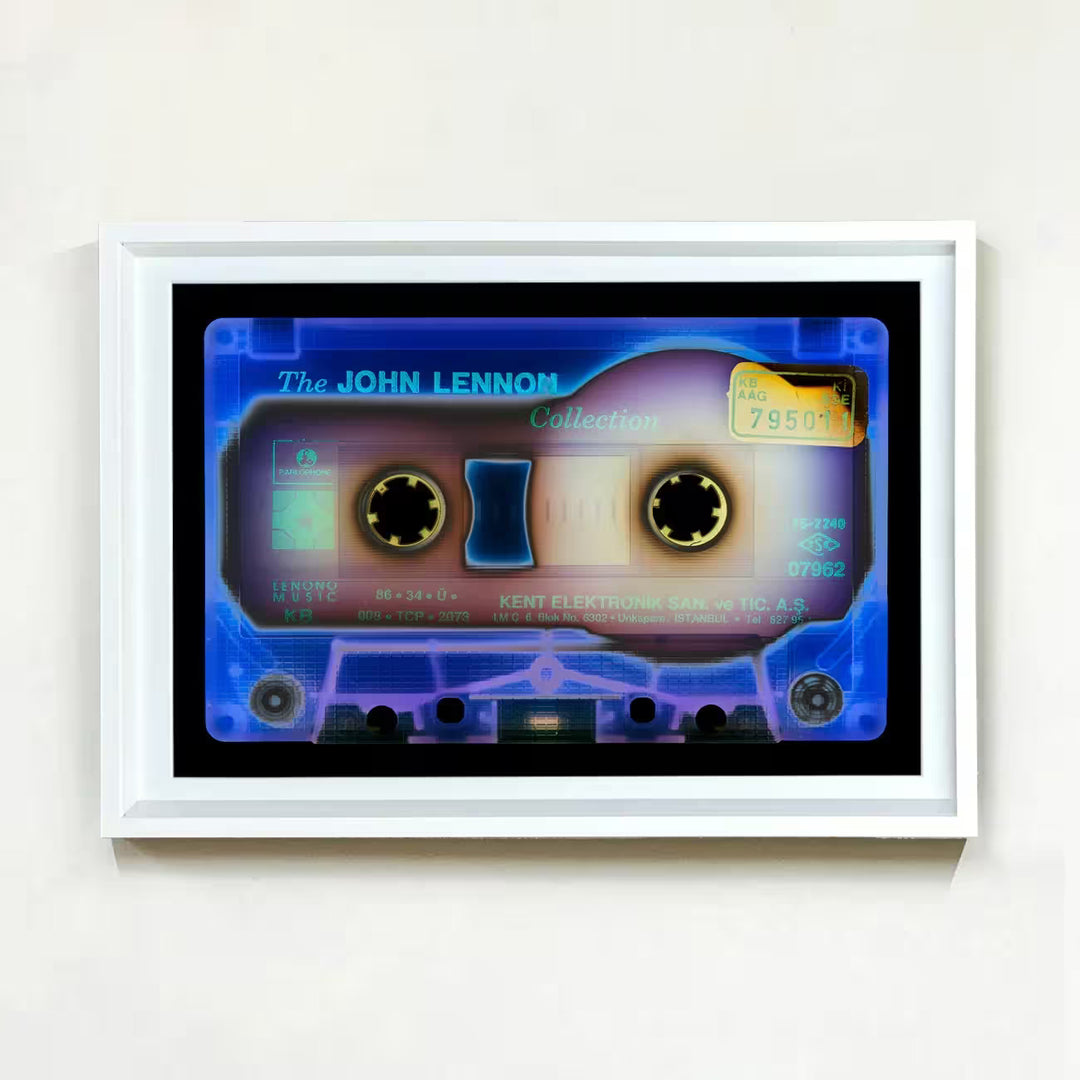 A white framed limited edition photograph by Richard Heeps using vibrant colours, the title is Tape Collection Elektronik Blue 2023