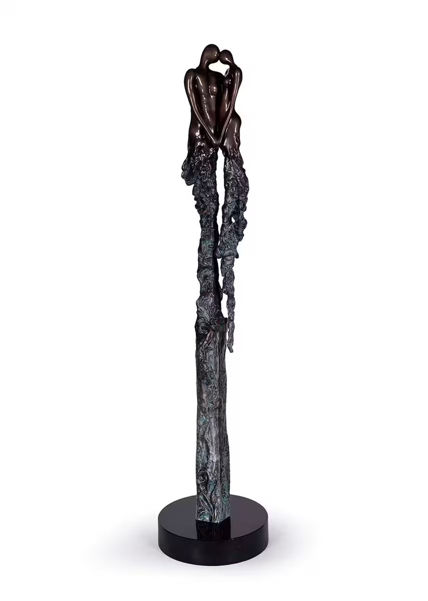 A Jennine Parker limited edition sculpture of two people holding hands, the title is Eternal Devotion