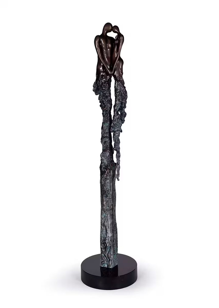 A Jennine Parker limited edition sculpture of two people holding hands, the title is Eternal Devotion