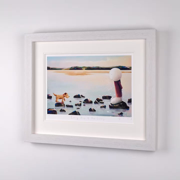 A Doug Hyde limited edition of a person stood on stepping stones with their dog trying to cross, the title is Every Step of the Way