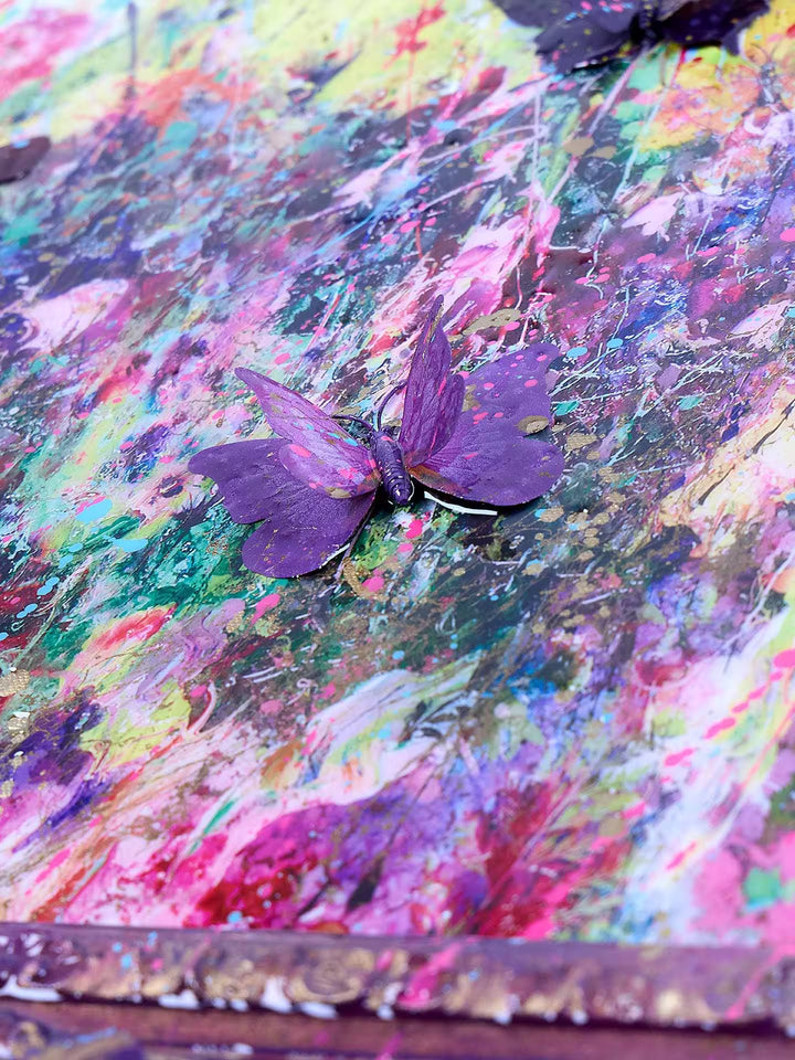 A Dan Pearce limited edition mixed media of colourful grasses with bright butterflies and paint splatters, the title is Evolution