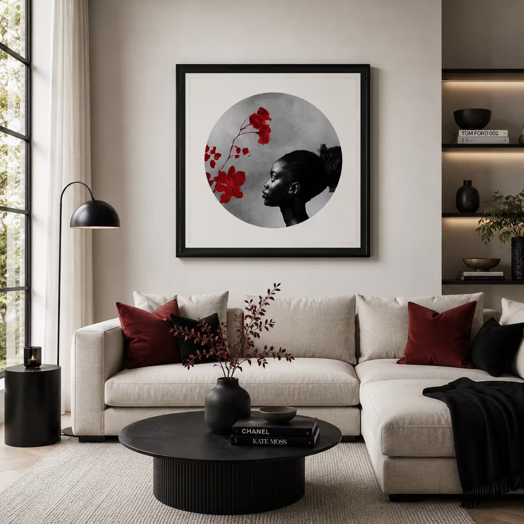 A Maxim limited edition of a red flower and a girl looking onto it, the title is Exhale
