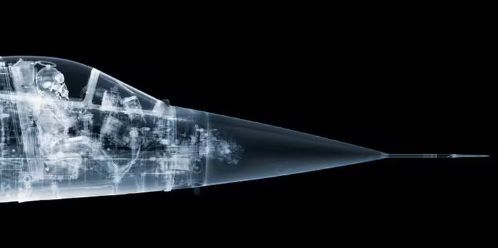 A limited edition Chromaluxe print by Nick Veasey of an X-Rayed vehicle with a skeleton sat in the cockpit, the title is F-104 Starfighter