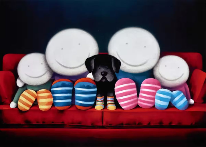 A Doug Hyde limited edition print of two adult and two children characters and a black dog sat on a red sofa all wearing striped socks, title is Family Time